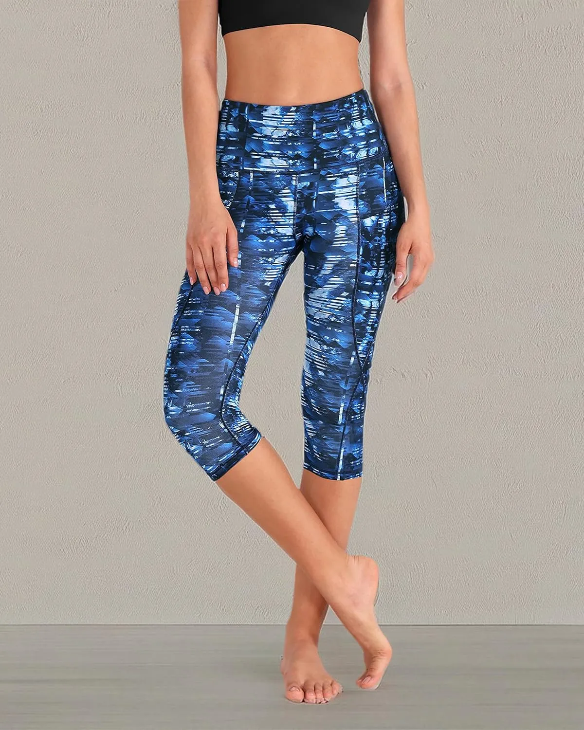 ODODOS Women's High Waisted Yoga Capris with Pockets, Tummy Control Non See Through Workout Athletic Running Capri Leggings