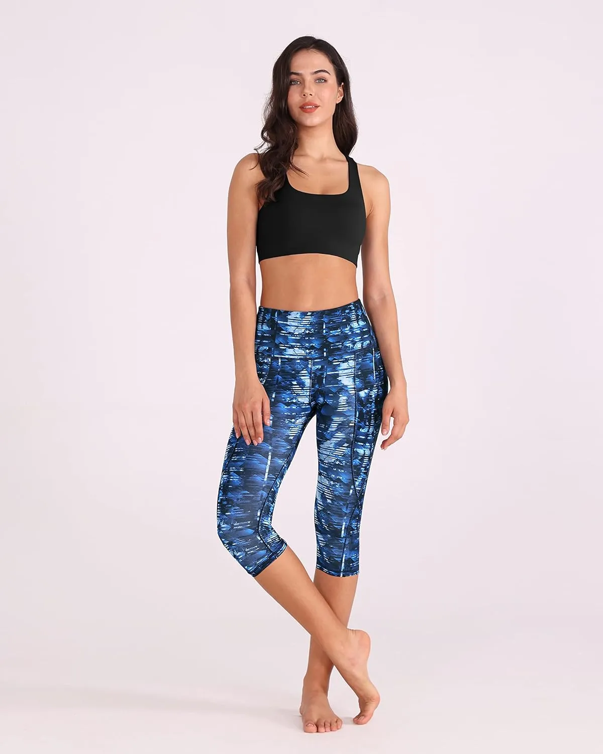ODODOS Women's High Waisted Yoga Capris with Pockets, Tummy Control Non See Through Workout Athletic Running Capri Leggings